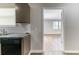 Modern kitchen with granite counters, subway tile, and view to living space at 5439 Farmview Close, Stone Mountain, GA 30088