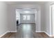 Open-concept living room with fireplace and neutral color palette, updated flooring throughout at 5439 Farmview Close, Stone Mountain, GA 30088