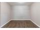 Neutral walls with updated laminate flooring in the empty bedroom at 5439 Farmview Close, Stone Mountain, GA 30088