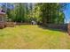 Lush backyard featuring a shed, well-maintained lawn, wooden fence, and a deck at 101 Valleydale Dr, Stockbridge, GA 30281