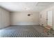 Unfinished basement space with exterior access and patterned flooring at 101 Valleydale Dr, Stockbridge, GA 30281