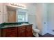 Bathroom with a dark wood vanity, large mirror, and a shower-tub combo at 101 Valleydale Dr, Stockbridge, GA 30281