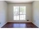 Bright room with dark wood floor, a window providing ample natural light, and white walls at 101 Valleydale Dr, Stockbridge, GA 30281