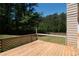 Wooden deck overlooking the wooded backyard with trees at 101 Valleydale Dr, Stockbridge, GA 30281
