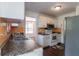 Functional kitchen with stainless steel refrigerator, white cabinets, and wood-look floors at 101 Valleydale Dr, Stockbridge, GA 30281