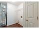 Functional laundry space with water heater, wire shelf, and convenient door at 101 Valleydale Dr, Stockbridge, GA 30281