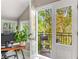 Balcony view framed by french doors featuring a chair and seasonal foliage at 1157 Hancock Ne Dr, Atlanta, GA 30306