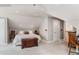 Neutral bedroom with sloped ceilings, carpet, and cozy decor at 1157 Hancock Ne Dr, Atlanta, GA 30306