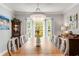 Bright dining room with large windows, wooden table, and crystal chandelier at 1157 Hancock Ne Dr, Atlanta, GA 30306