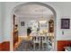Elegant dining room showcasing an archway, hardwood floors, and wood trim at 1157 Hancock Ne Dr, Atlanta, GA 30306