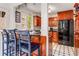 Kitchen with granite counters, custom wood cabinets, stainless steel appliances, and a breakfast bar at 1157 Hancock Ne Dr, Atlanta, GA 30306