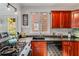Kitchen featuring granite countertops, wood cabinets, stainless steel appliances, and a window with natural light at 1157 Hancock Ne Dr, Atlanta, GA 30306