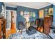 Eclectic living room with dark blue walls, instruments and ample seating at 1157 Hancock Ne Dr, Atlanta, GA 30306
