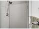 Modern tiled shower with glass enclosure and showerhead at 1157 Hancock Ne Dr, Atlanta, GA 30306