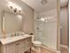 Well-lit bathroom with a glass-enclosed shower, modern vanity, and neutral color scheme at 125 Stoney Ridge Dr, Alpharetta, GA 30022