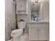 Well-lit bathroom with modern fixtures, white vanity, toilet, and shower featuring a patterned shower curtain at 125 Stoney Ridge Dr, Alpharetta, GA 30022