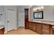 Bathroom features granite countertops, and wood cabinets and is well lit with neutral paint at 125 Stoney Ridge Dr, Alpharetta, GA 30022