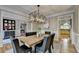 Formal dining room showcasing a wooden table and decorative lighting at 125 Stoney Ridge Dr, Alpharetta, GA 30022