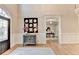 Inviting foyer with gleaming hardwood floors and elegant decorative mirror at 125 Stoney Ridge Dr, Alpharetta, GA 30022