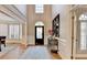 Welcoming foyer with view to formal dining room and front door with sidelights at 125 Stoney Ridge Dr, Alpharetta, GA 30022