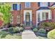 Close-up of the front entrance showcasing a charming doorway and manicured garden at 125 Stoney Ridge Dr, Alpharetta, GA 30022