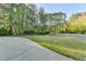 Well-manicured front yard with lush greenery and mature trees provides a welcoming curb appeal at 125 Stoney Ridge Dr, Alpharetta, GA 30022