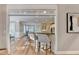 Kitchen bar with bar stools and a view of the dining room and an adjacent living room at 125 Stoney Ridge Dr, Alpharetta, GA 30022