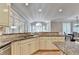 Bright kitchen features granite countertops, tiled backsplash, stainless steel appliances, and ample cabinet space at 125 Stoney Ridge Dr, Alpharetta, GA 30022