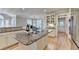Open kitchen features granite island, breakfast bar, stainless steel appliances, and hardwood flooring at 125 Stoney Ridge Dr, Alpharetta, GA 30022