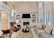 Open-concept living room with fireplace, built-in shelving and high ceilings at 125 Stoney Ridge Dr, Alpharetta, GA 30022