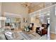 Bright living room with hardwood floors, a fireplace, and an adjacent kitchen and dining area at 125 Stoney Ridge Dr, Alpharetta, GA 30022