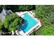 Aerial view of the clear blue community pool featuring a splash pad surrounded by lounge chairs at 125 Stoney Ridge Dr, Alpharetta, GA 30022