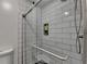 A modern shower featuring white subway tile and a glass enclosure with chrome hardware at 125 Stoney Ridge Dr, Alpharetta, GA 30022