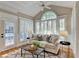 Bright sun room with shuttered windows, a ceiling fan, and a comfortable couch at 125 Stoney Ridge Dr, Alpharetta, GA 30022