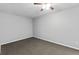 The bedroom features neutral walls, carpet, and ceiling fan at 1303 Flat Shoals Rd, Atlanta, GA 30349