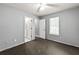 Bedroom with carpeted floor, a large window and access to a bathroom at 1303 Flat Shoals Rd, Atlanta, GA 30349