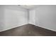 The bedroom features neutral walls, carpet, and a door at 1303 Flat Shoals Rd, Atlanta, GA 30349