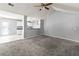 Spacious living room with neutral paint and carpet, open to the kitchen at 1303 Flat Shoals Rd, Atlanta, GA 30349