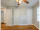 Bedroom featuring hardwood floors, fresh paint, and multiple white doors at 1328 Lockhaven Sw Cir, Atlanta, GA 30311