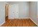 Bedroom featuring hardwood floors, fresh paint, and a closet at 1328 Lockhaven Sw Cir, Atlanta, GA 30311