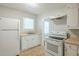 Practical kitchen features essential appliances, ample counter space, and great natural light for cooking and cleaning at 1328 Lockhaven Sw Cir, Atlanta, GA 30311