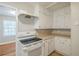 Efficient kitchen layout with ample cabinet space and modern appliances, ideal for cooking enthusiasts at 1328 Lockhaven Sw Cir, Atlanta, GA 30311