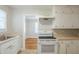 Well-lit kitchen with hardwood floors, functional appliances, and ample counter space, perfect for cooking and meal prep at 1328 Lockhaven Sw Cir, Atlanta, GA 30311