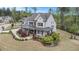 Areal view showing beautiful landscaping and covered front porch that highlights the home's charming curb appeal at 3039 Malbec Vly, Acworth, GA 30101