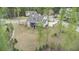 Spacious backyard with lush greenery surrounding an elegant two-story home at 3039 Malbec Vly, Acworth, GA 30101