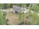 This backyard has a large grassy lawn and a multi-tiered porch with entrances on each level at 3039 Malbec Vly, Acworth, GA 30101