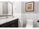 Bathroom features a marble countertop, dark wood cabinet, gray walls, and white subway tile at 3039 Malbec Vly, Acworth, GA 30101