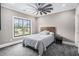Cozy bedroom with plush carpeting, large window, and ceiling fan at 3039 Malbec Vly, Acworth, GA 30101