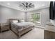 Bedroom with a ceiling fan, carpet, window, and furnishings at 3039 Malbec Vly, Acworth, GA 30101
