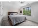 Bright bedroom with ceiling fan and large window providing natural light at 3039 Malbec Vly, Acworth, GA 30101